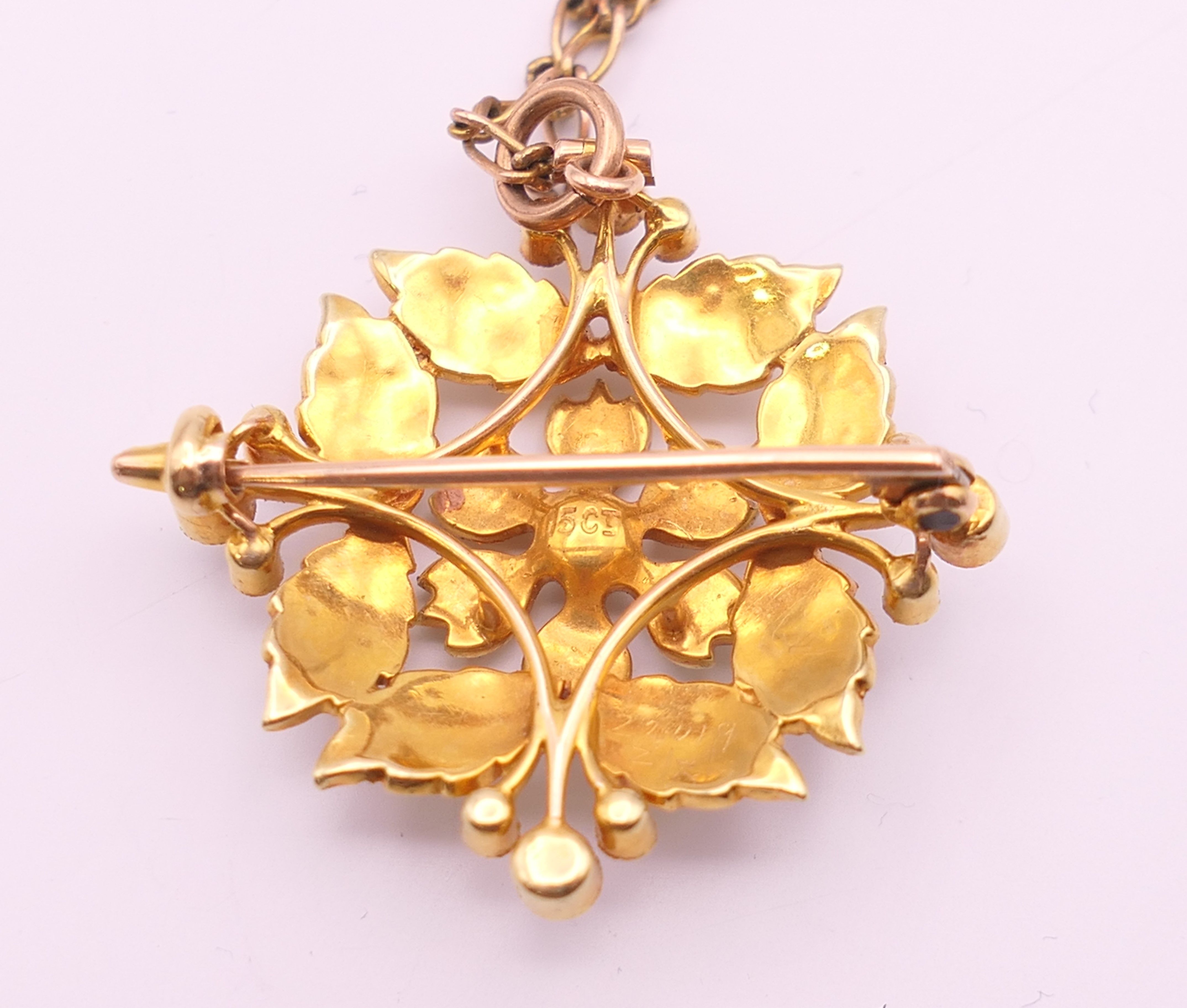 A 15 ct gold and seed pearl pendant/brooch on a 9 ct gold chain. - Image 5 of 9