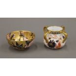 Two small Coalport vessels, each decorated in the Imari palette. The largest 4 cm high.