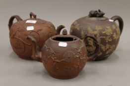 Three Elers type red clay teapots. The largest 21 cm high.