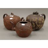 Three Elers type red clay teapots. The largest 21 cm high.