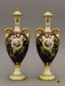 A pair of Coalport porcelain lidded vases. 33 cm high.