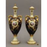 A pair of Coalport porcelain lidded vases. 33 cm high.