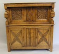 An early 20th century carved oak court cupboard. 137 cm wide.