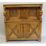 An early 20th century carved oak court cupboard. 137 cm wide.