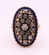 An antique 18 ct gold, blue enamel and diamond ring. Ring size M.