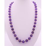 An amethyst and 14 ct gold necklace. 52 cm long.