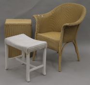 A Lloyd Loom chair, a Lloyd Loom linen basket and a stool. The former 64 cm wide.