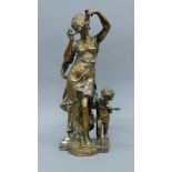 A bronze model of a dancing lady and a child. 46 cm high.