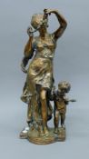A bronze model of a dancing lady and a child. 46 cm high.