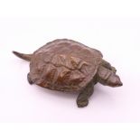 A bronze model of a tortoise. 5.5 cm long.