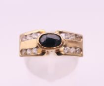 A 9 ct gold sapphire ring. Ring size P/Q. 4.5 grammes total weight.