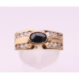 A 9 ct gold sapphire ring. Ring size P/Q. 4.5 grammes total weight.