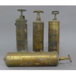 Four vintage American fire extinguishers.