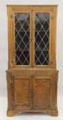 An oak lead glazed corner cupboard. 76 cm wide x 174.5 cm high.