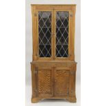 An oak lead glazed corner cupboard. 76 cm wide x 174.5 cm high.