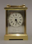 A Taylor & Bligh silver mounted carriage clock. 15 cm high.