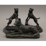 A pair of bronze dog form bookends and a model of a dog. The former 19 cm high.
