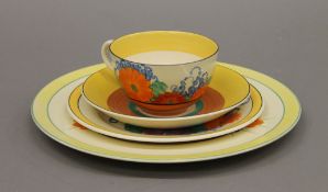 A Clarice Cliff Bizarre Gayday trio and a Clarice Cliff Crocus pattern plate.