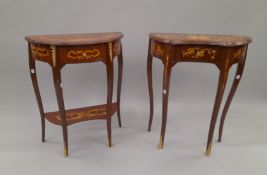 Two similar side tables. The largest 61 cm wide.