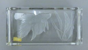 A Kosta Boda glass paperweight. 18 cm wide.