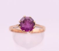 An 18 ct gold amethyst ring. Ring size Q. 2.6 grammes total weight.