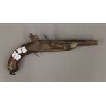 An antique flintlock pistol. 36 cm long.