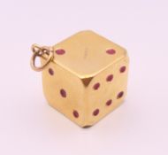 A 9 ct gold lucky gamblers dice charm/ pendant. 1.5 cm square. 4.9 grammes.
