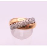 A platinum and 18 ct gold trilogy diamond eternity ring. Ring size K. 10.6 grammes total weight.