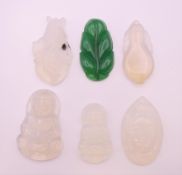 Six agate and jade pendants. Largest 5 cm high.