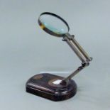 A magnifying glass on stand.