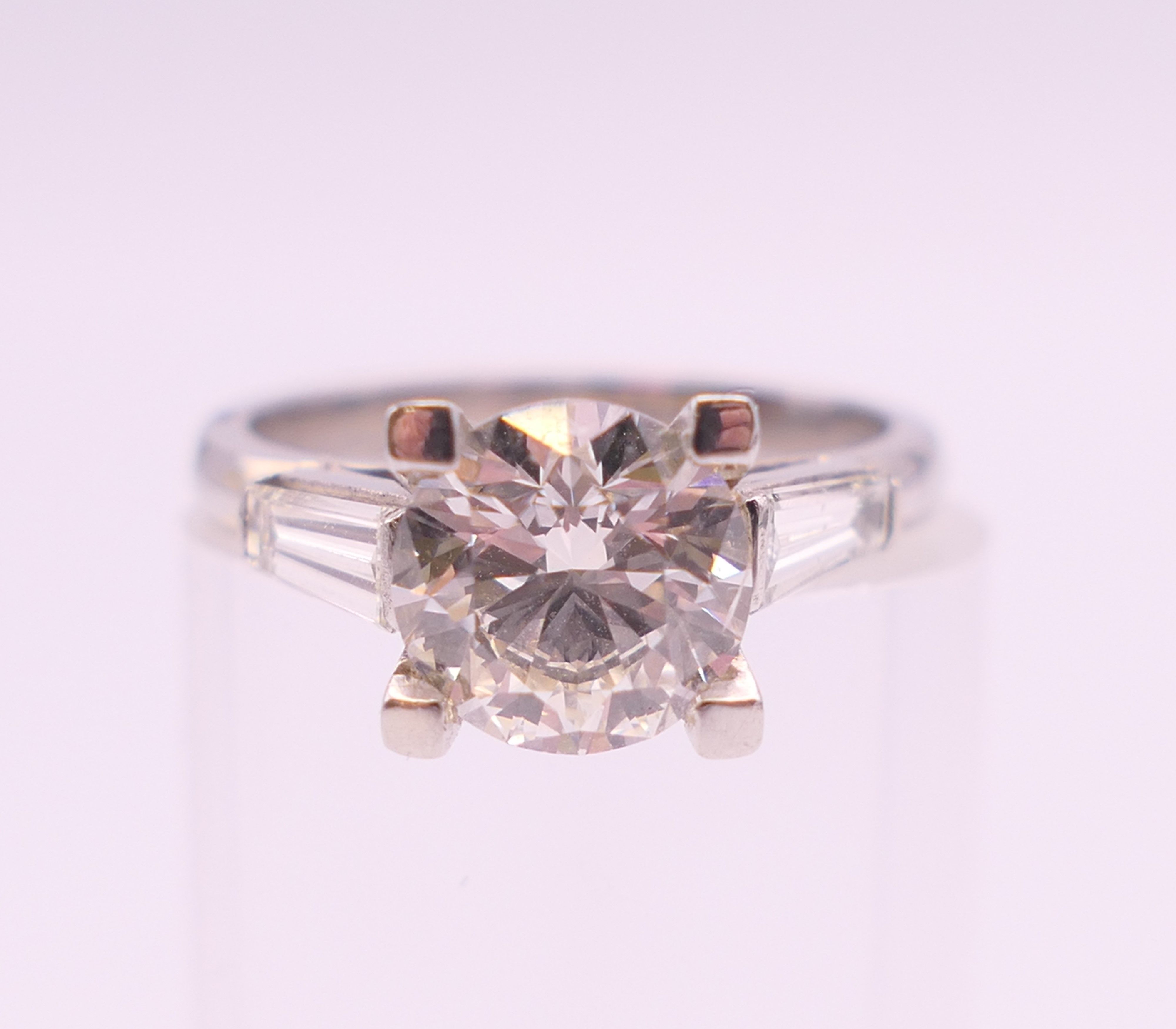 A platinum and diamond ring, - Image 2 of 7