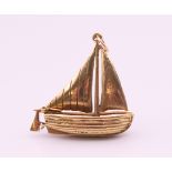 A 9 ct gold pendant formed as a sailing boat. 3 cm x 3.25 cm high. 6.9 grammes.