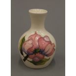 A small Moorcroft pottery vase. 9 cm high.