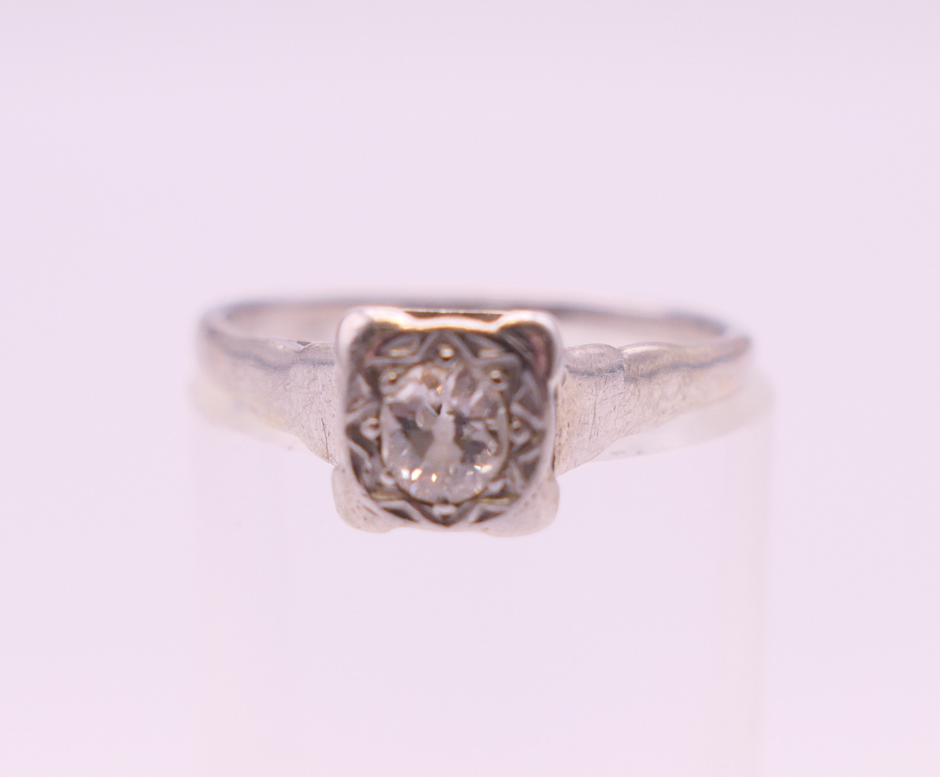 A platinum and 18 ct gold diamond solitaire ring. Ring size L/M. - Image 2 of 5