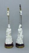 A pair of Chinese blanc de chine figural lamps. The largest 55 cm high overall.