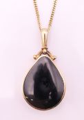 A 9 ct gold, abalone and onyx pendant on a 9 ct gold chain. Pendant 4.
