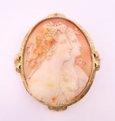 A Victorian unmarked yellow metal framed carved cameo brooch, in fitted case. 6.5 cm high.