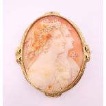 A Victorian unmarked yellow metal framed carved cameo brooch, in fitted case. 6.5 cm high.