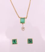A 9 ct gold, emerald and diamond pendant necklace with matching earrings. Pendant 1.