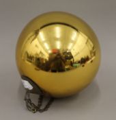 A 19th century gilt glass witches ball. Approximately 25 cm high.
