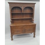 A Victorian carved oak dresser. 138.5 cm wide.