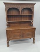 A Victorian carved oak dresser. 138.5 cm wide.