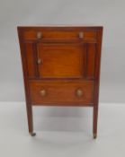 A 19th century line inlaid mahogany pot cupboard. 50.5 cm wide.