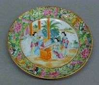 A 19th century Canton famille rose plate. 20.5 cm diameter.