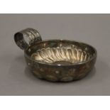 A French silver wine taster. 7.5 cm diameter. 56.3 grammes.