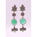 A pair of gold, diamond and chrysoprase stone drop earrings. 6.5 cm long.