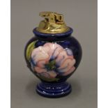 A Moorcroft table lighter. 11 cm high.