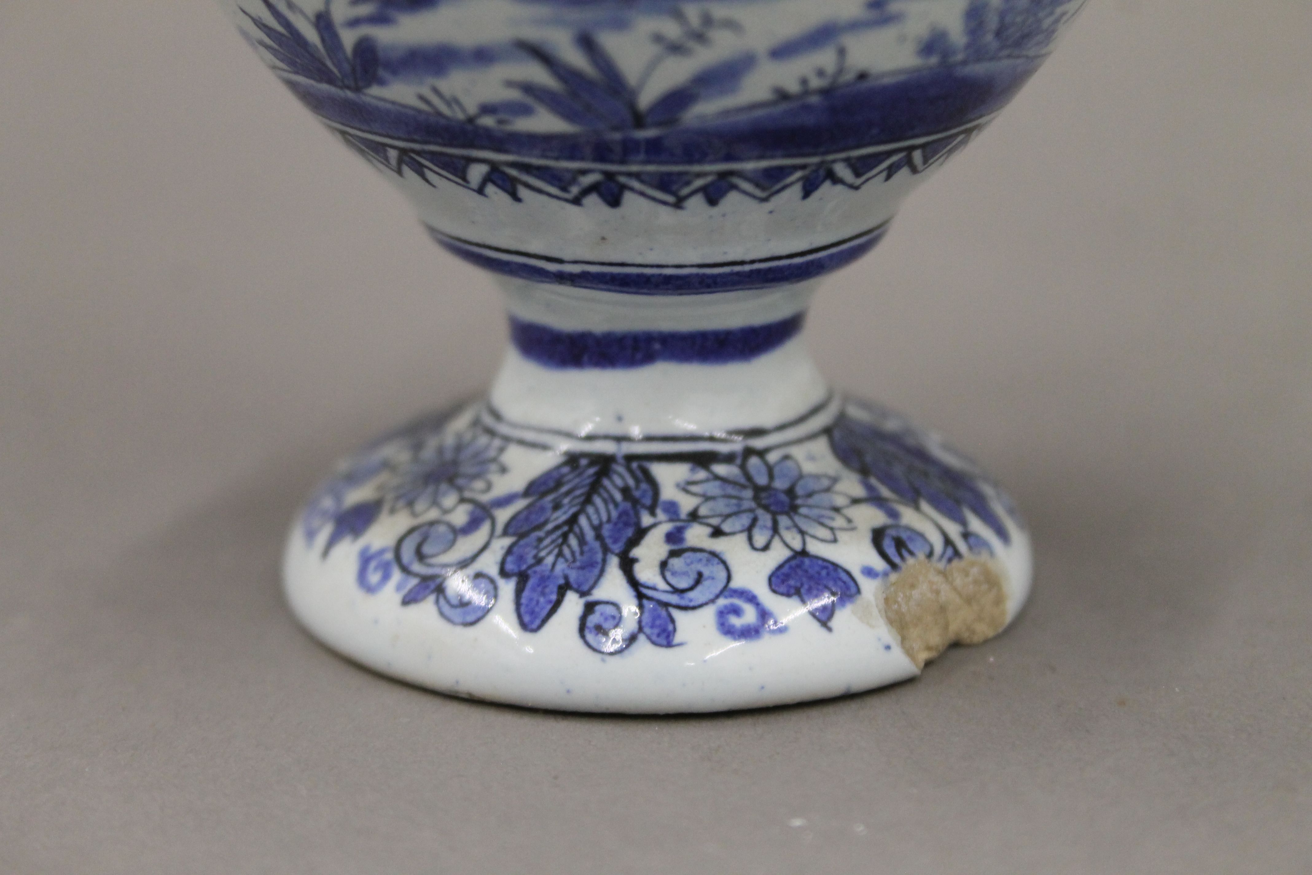 A pair of small 19th century blue and white ewers. 17.5 cm high. - Image 6 of 6