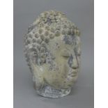 A model Buddha head. 33 cm high.