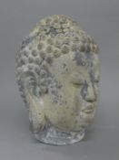 A model Buddha head. 33 cm high.